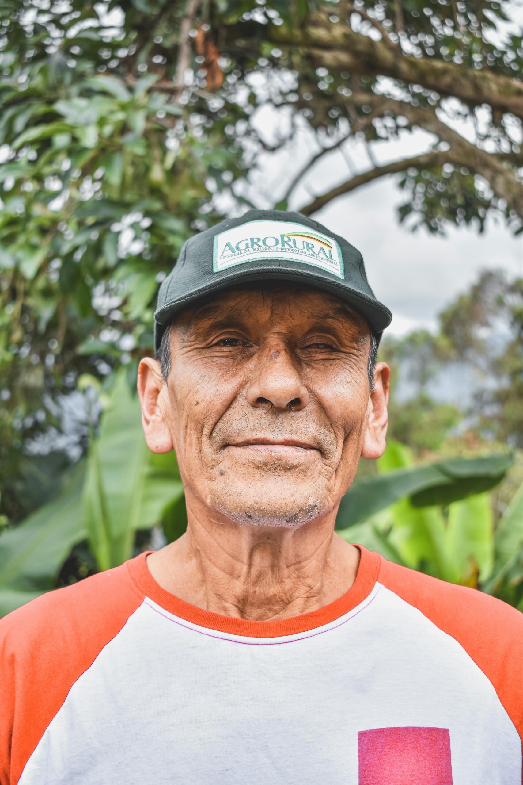 Close-up portrait of a smiling man outdoors in Collonce, Amazonas, Perú.